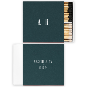 Elevate your special day with the Stately Love Initials Wedding Match, featuring a stylized, architectural design. The couple's initials are artfully separated by a vertical line, creating an elegant front display. The back details the city and state in block capitals, followed by the date, embodying structured sophistication.