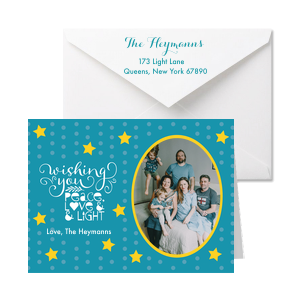 Wish your family peace, love, and light with this custom Christmas Card! Personalize this starry Christmas card with your family name and a photo. 