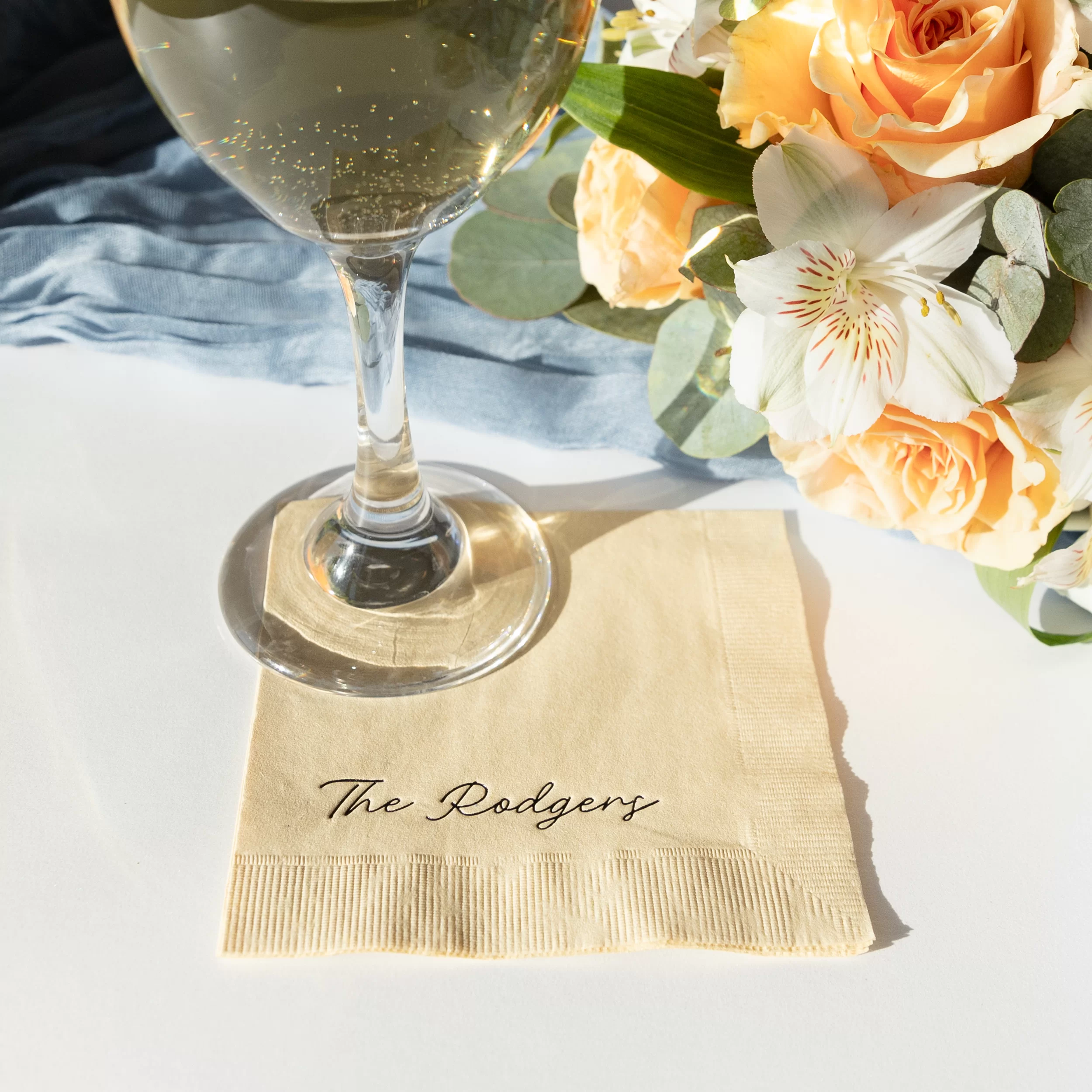 handwritten script family name, cocktail napkin