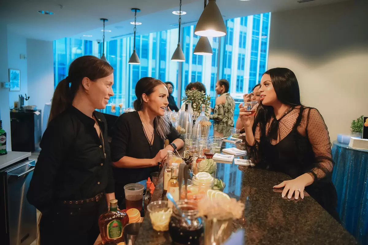 candid photo of guests at elegant shimmer and ombre gender reveal party