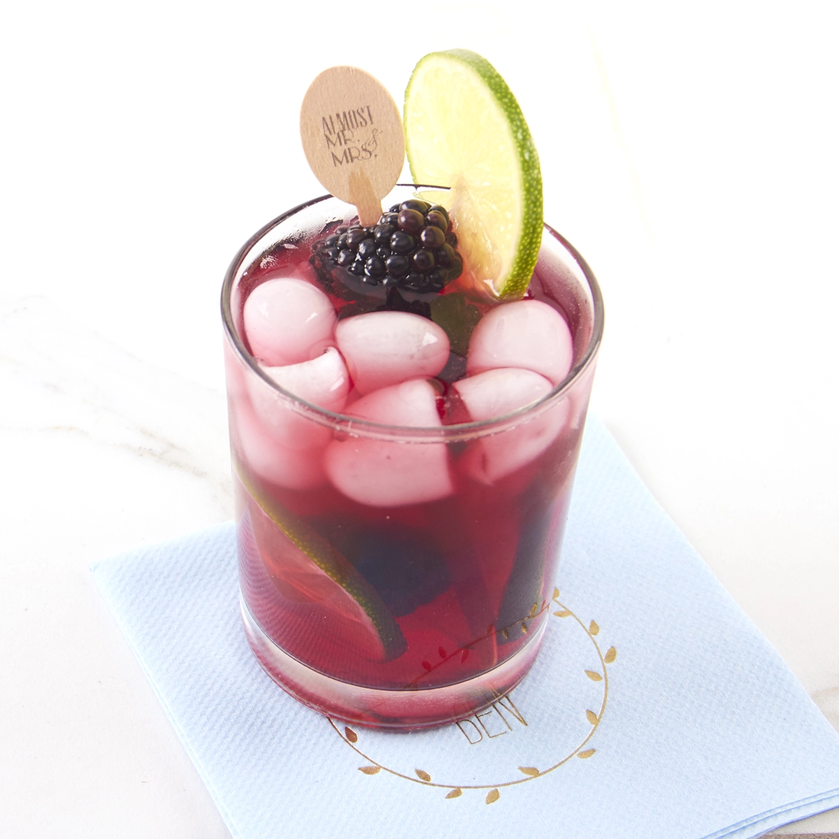 blackberry mule with personalized drink stirrer and personalized cocktail napkin