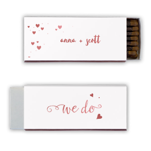 Proclaim your love with the We Do Name Heart Wedding Matchbox. Featuring the timeless words "We do" in elegant script and a heart symbol, this design beautifully signifies the couple's unity. A charming nod to the commitment that seals the deal!