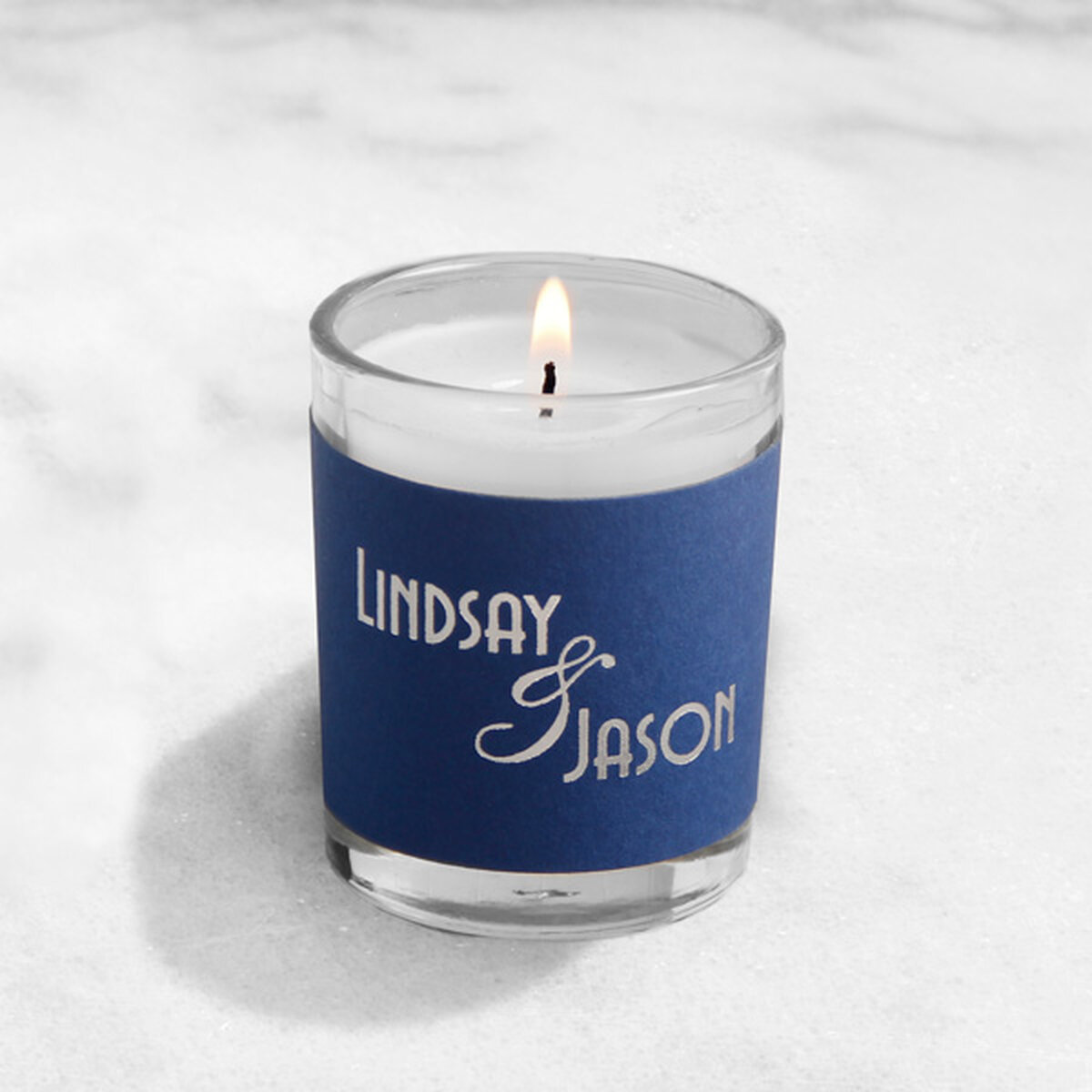Votive candle with paper wrap customized with silver foil stamped design