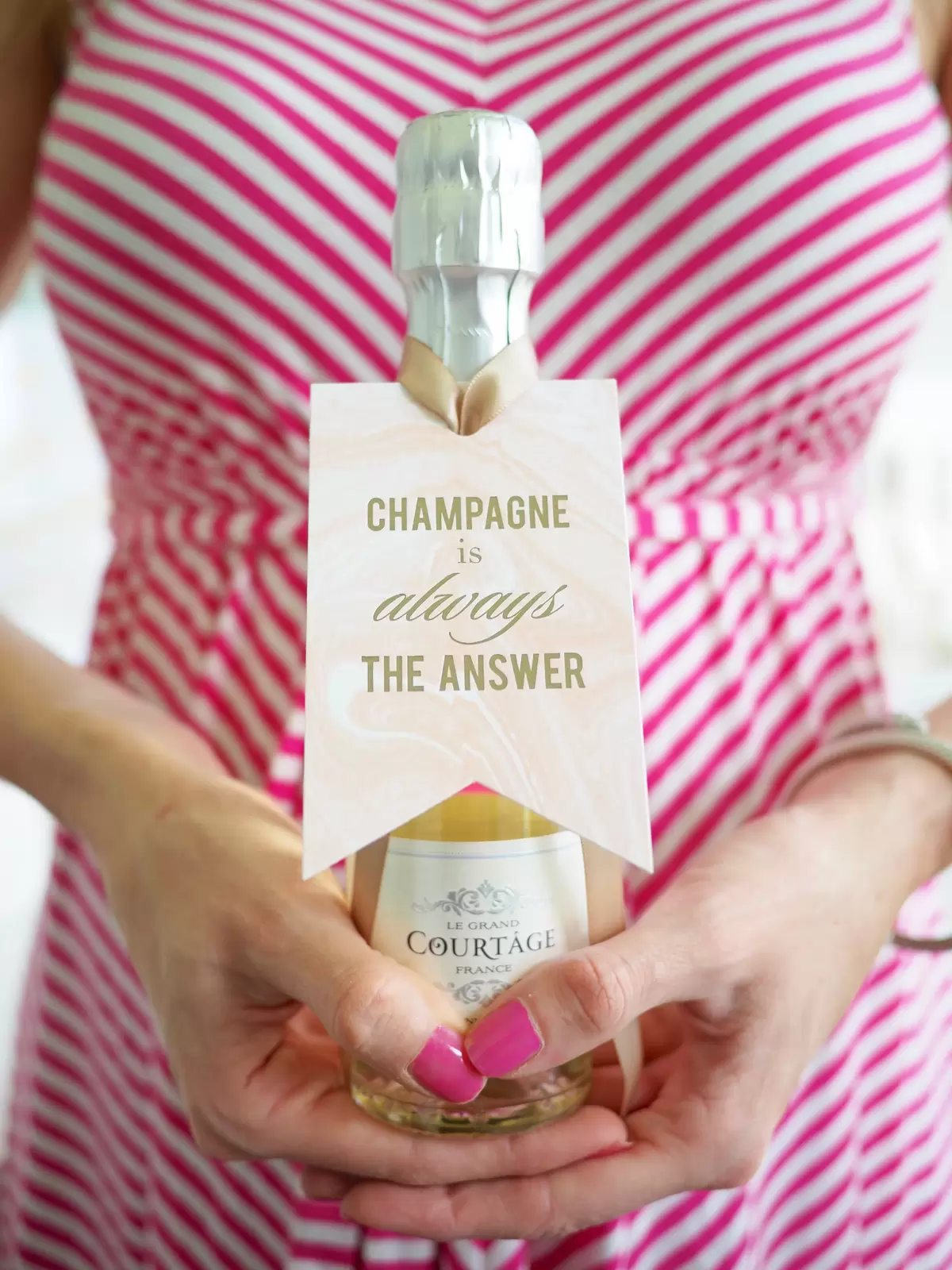 custom designed gift tag on mini champagne party favor