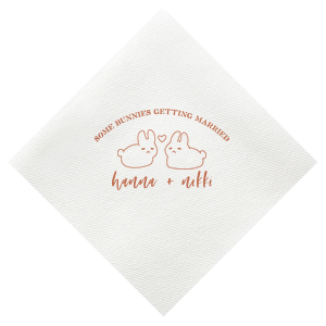 Hop into matrimonial joy with the Some Bunnies Wedding Napkin, complete with an adorable drawing of two bunnies and a heart nestled between them. The playful phrase "Some Bunnies Getting Married" sets a whimsical tone, while the area below awaits the couple's names, scripted with modern elegance. A delightful addition to your wedding tablescapes.