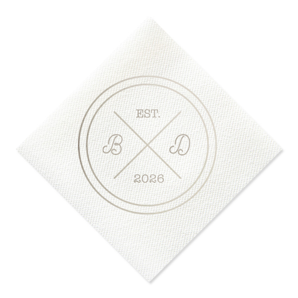 Infuse your reception with the bespoke elegance of the Circle Badge Initials Napkin, reminiscent of an exclusive club crest. 'EST.' and the wedding year anchor the design, with the couple's scripted initials nestled within the distinguished bands, crafting a personal insignia of love.