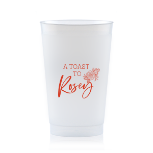 Raise a glass to beauty and sentiment with the Floral Toast Cup. Featuring "A TOAST TO" in bold block letters, framed by an intricate peony design symbolizing love and joy. Personalize it with the celebrant's name in beautiful script, making every sip a celebration of their special day.