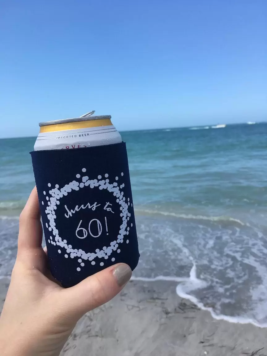 personalized koozie at the beach 