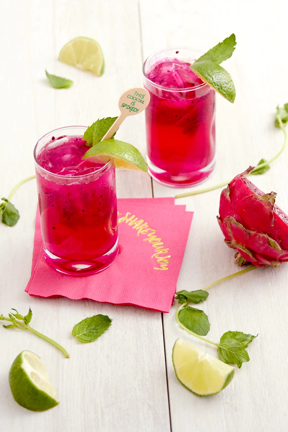Dragon Fruit Mojito cocktail recipe with personalized cocktail napkins and custom drink stirrers