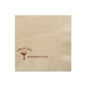 Embrace the whimsy with the A Tini Bit Older Birthday Napkin, featuring a chic, hand-drawn martini glass. The phrase "A tini bit older," scripted above the illustration, brings a playful note to the celebration. Customize beside the glass with your name and the milestone birthday in a classic serif font, adding a personal and stylish twist to your festivities.