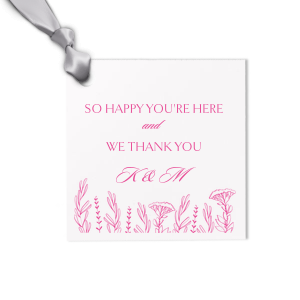 Make every guest feel special with our beautifully letterpress printed personalized gift tag. This elegant square tag expresses heartfelt gratitude with the message "So Happy You're Here and We Thank You,". Adorned with an intricate floral motif at the base, this high quality, custom print tag enhances the sophisticated design with the tactile luxury of letterpress printing.