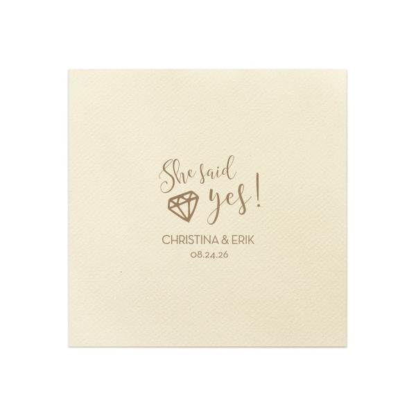 With the She Said Yes Diamond Engagement Napkin, let the fun begin! This exuberant design nestles a sparkling diamond into the joyful exclamation, perfect for celebrating a lifetime of love. Personalize with the couple's name and date for an unforgettable celebration.

