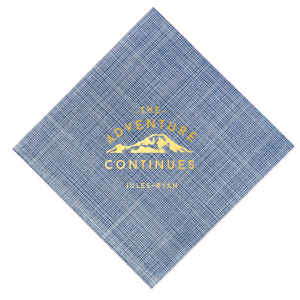 The Adventure Continues Napkin design encapsulates the spirit of exploration and shared journey. Featuring a graphic of snow-capped mountains with "The Adventure" arching over and "CONTINUES" below, it symbolizes the ongoing journey of the couple. Their names personalize this narrative of continuous adventure and discovery as they embark on life together. 