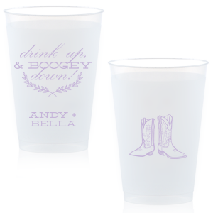 Kick up your heels with the Boogey Down Cowboy Cup emblazoned with 'Drink Up & Boogey Down!' and a foliage flourish. Personalized with your names and adorned with cowboy boots, it's perfect for a lively, Western-themed celebration.
