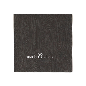 Define your wedding tablescape with the Bold Union Ampersand Napkin, where the couple's names are joined by a striking and modern ampersand. This minimalistic design lends a contemporary feel to your marital celebration.