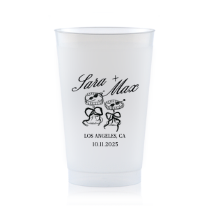 The Wedding Glass & Bow Cup is the must have trendy design for your one of a kind lifetime event. Featuring hand-drawn bows tied around champagne glasses alongside customizable text in the screen printed ink color of your choice to best pair with your party's vibe.