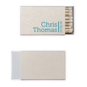 The Simply Elegant Names and Vertical Date Matchbox embodies modern sophistication with a minimalist approach. It features the couple's names beside a bold vertical line that artfully separates them from the event date, printed vertically from bottom to top. This design's clean lines and elegant simplicity make it a refined choice for any celebration.
