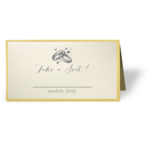 Customize place cards and impress guests with beautiful wedding details. This card leaves space for a name and table number, right under our classic Wedding Rings graphic and catchy calligraphy saying. Choose your theme colors and add your wedding date for a personal touch. 