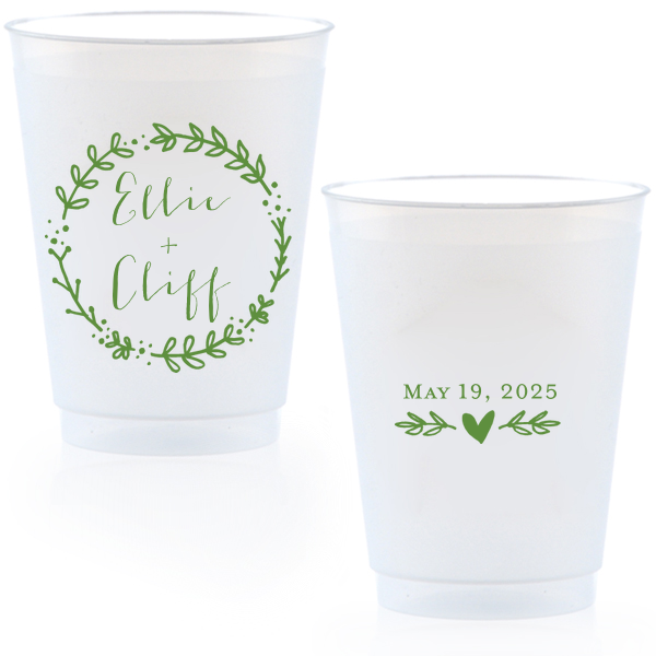 Raise a glass with the Wreath Names Cup where a playful leafy wreath lovingly encases your names. On the back, a branch with a centered heart underscores the date, infusing whimsy into every sip at your celebration.