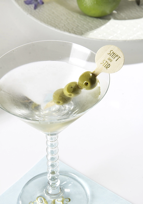 dirty martini with custom cocktail stirrer