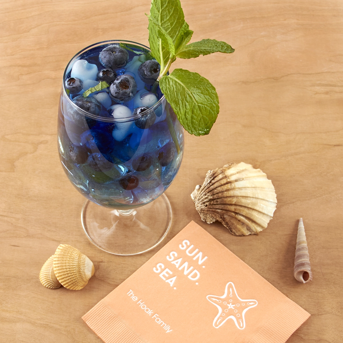 blue beach drink with personalized cocktail napkin