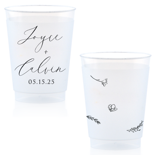 Sip in style with the Botanical Breeze Cup, blending elegance and whimsy. One side features the couple's names in prominent modern script, with the event date below. The other side delights with four playful, doodle-like botanical drawings, adding a light-hearted, charming touch to any celebration.