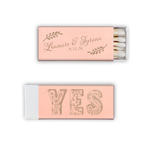 Ignite love’s spark with the Romantic YES Wedding Matchbox. Elegant leafy boughs frame the newlyweds' names in flourishing script on one side. Flip to an exuberant, floral-filled "YES" on the other—a timeless, botanical cheer for your happily ever after!