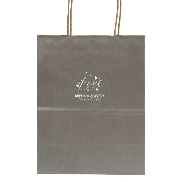 Let affection take flight with the Love and Hearts Bag, where 'Love' is joyfully scripted, surrounded by a flutter of hearts. Below, the couple’s names and date ground this exuberant design, making every gift a testament to their love's vitality.