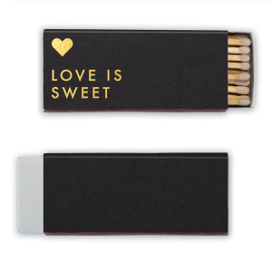 Celebrate the essence of love with the Love is Sweet Matchbox. Boldly declaring "Love is Sweet" with a floating heart above, this design captures the pure and heartfelt nature of love. A beautiful reminder that love, in all its complexity, is always sweet.