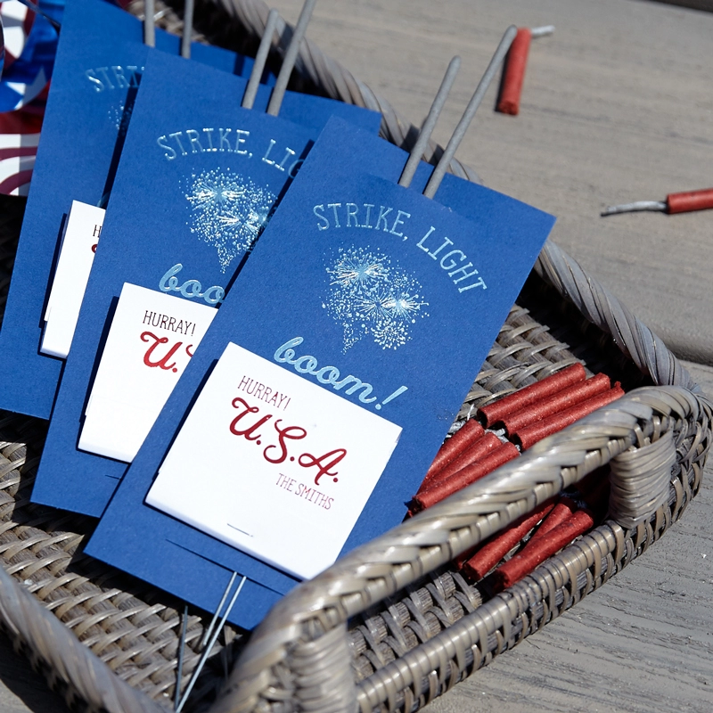 Sparkler sleeves with phrase “Strike, Light, Boom!”