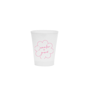 Sip in style at your whimsical wedding with the Kitschy Cocktail Hour Floral Frame Cup. Personalize this charming vessel with the couple's names, elegantly scripted within a blooming flower-shaped frame. A modern and enchanting choice for your celebratory toasts.