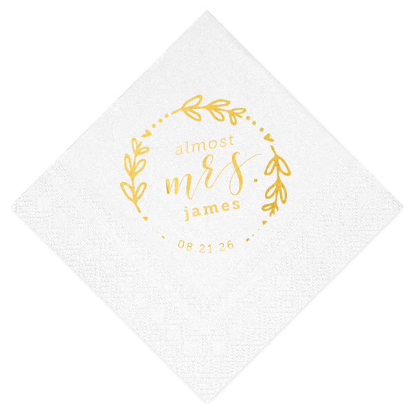 The Almost Mrs Heart Frame Bridal Shower Napkin joyfully heralds the bride-to-be's journey from Miss to Mrs. Encircled by a heart-leaf frame, the flowing, swirling script of "Mrs." takes center stage, accompanied by her soon-to-be last name and the wedding date. A charming, celebratory design!