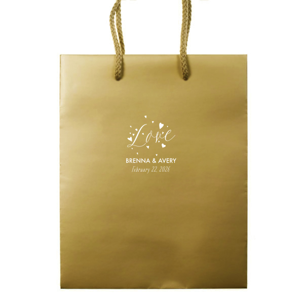 Let affection take flight with the Love and Hearts Bag, where 'Love' is joyfully scripted, surrounded by a flutter of hearts. Below, the couple’s names and date ground this exuberant design, making every gift a testament to their love's vitality.