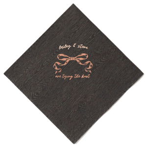 Announce your union with the Nuptial Knot Bow Napkin, featuring a romantic bow graphic and the sweet declaration 'are tying the knot.' Personalize with both your names to add a loving touch to your engagement party or wedding reception.
