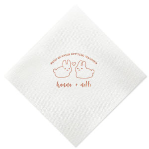 Hop into matrimonial joy with the Some Bunnies Wedding Napkin, complete with an adorable drawing of two bunnies and a heart nestled between them. The playful phrase "Some Bunnies Getting Married" sets a whimsical tone, while the area below awaits the couple's names, scripted with modern elegance. A delightful addition to your wedding tablescapes.