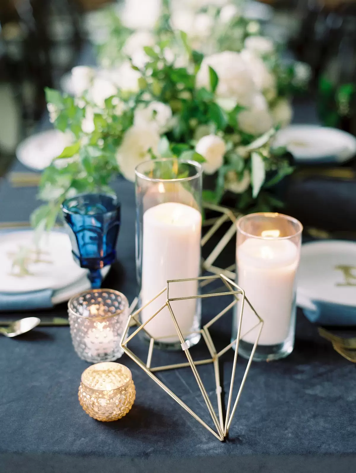 industrial glam party table decorations with wire diamonds, colored glasses and garland