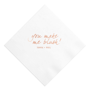 The Loving Blush Napkin exudes romantic charm. It features the phrase "you make me blush!" in a playful, lowercase script, capturing the essence of being touched by love and affection. Beneath, the couple’s names add a personal touch, beautifully embodying a moment of tender, loving emotion.
