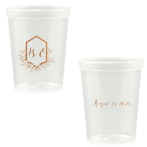 Sip with pride from the Family Crest Initials Cup, where a modern emblem blooms with hand-drawn foliage, reminiscent of ivy-clad ancestry. The couple's script initials rest within, and the event date on the reverse, crafting a legacy in each toast.