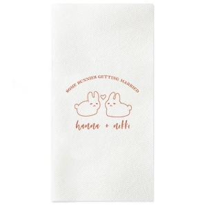Hop into matrimonial joy with the Some Bunnies Wedding Napkin, complete with an adorable drawing of two bunnies and a heart nestled between them. The playful phrase "Some Bunnies Getting Married" sets a whimsical tone, while the area below awaits the couple's names, scripted with modern elegance. A delightful addition to your wedding tablescapes.
