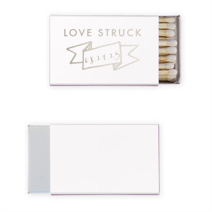 Ignite romance with the Love Struck Banner Matchbox featuring the smitten phrase above a banner cradling your special date. This design charmingly captures the couple's love, making each strike a celebration of their union.