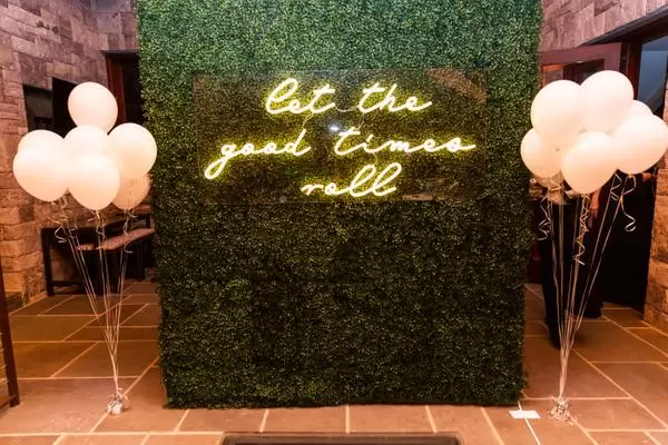 neon wedding song proclaiming "let the good times roll"