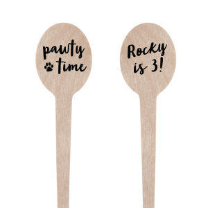 The Pawty Time Stir Stick celebrates milestones with a customized declaration perfect for adding a personal touch to your, your child's, or your pet's special day. The reverse side features an adorable paw print graphic with the playful words "Pawty Time," also in the same relaxed script, setting the tone for a fun-filled event. This charming stirrer is a delightful accessory for birthday parties, pet adoption anniversaries, or any occasion worth throwing a "pawty" for.