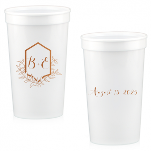 Sip with pride from the Family Crest Initials Cup, where a modern emblem blooms with hand-drawn foliage, reminiscent of ivy-clad ancestry. The couple's script initials rest within, and the event date on the reverse, crafting a legacy in each toast.