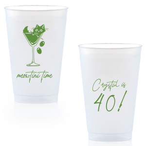 Toast to another fabulous year with the Meowtini Time Birthday Cup, showcasing a whimsical drawing of a cat cozily perched in a martini glass, olives playfully cascading over the rim. Personalize with your name and milestone age to the right of the glass in an elegant script font, inviting a celebratory sip with feline flair.