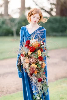 stunning velvet bridesmaid dress and bouquet