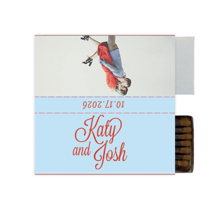Capture love’s spark with the Love Snapshot Photo Matchbox. It features the couple’s names in a fun, flirty script on the front. The back displays a playful photo of the couple, radiating their shared joy. The celebration date adorns the side, making this matchbox a memorable keepsake of their special day. This design invites couples to choose a beloved photo to personalize their own matchbox, adding a unique and intimate touch to their wedding celebration.