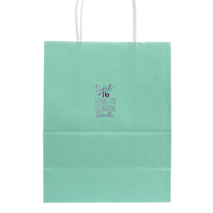 The Sweet 16 Bag exudes youthful joy with its swirling script celebrating the milestone birthday. Flourished 'Sweet' over a bold '16', coupled with a grateful 'Thanks for Celebrating' and the birthday star's name, makes this design a perfect, vibrant token for any Sweet Sixteen bash.