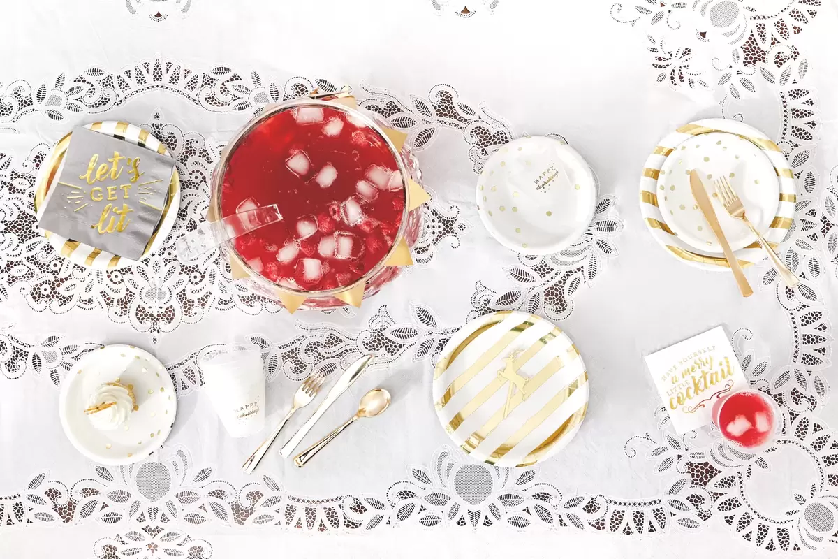 christmas party supplies with gold paper plates and cute party cups