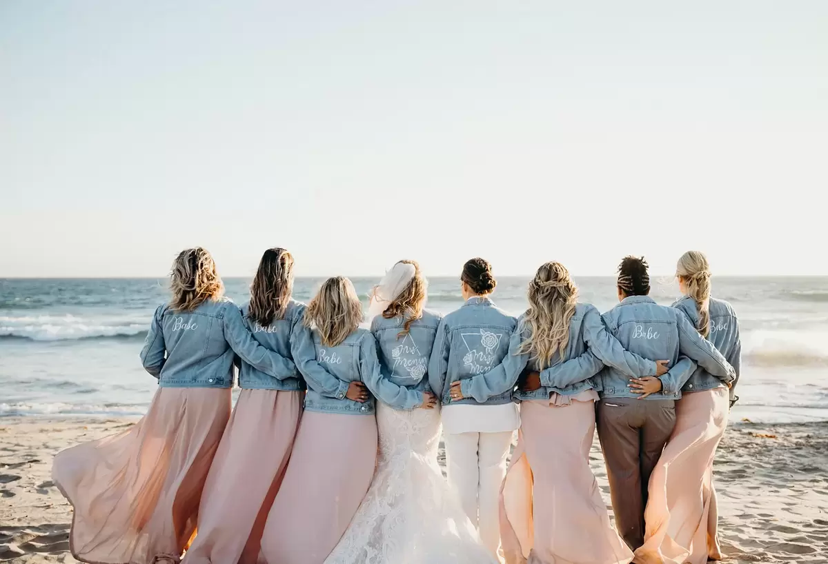 bridal party ocean picture ideas with bridesmaid jean jackets