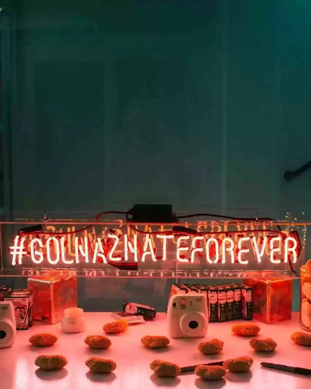 bright neon wedding sign displaying wedding hashtag